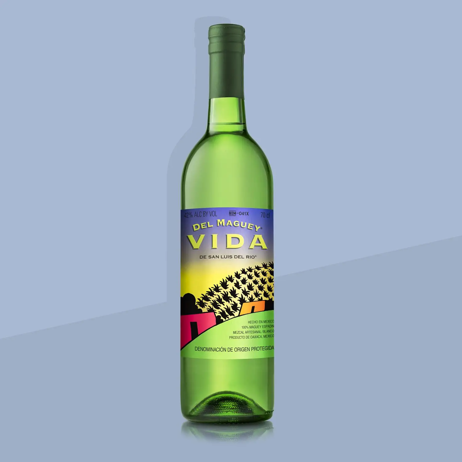 Del Maguey Vida mezcal bottle and label on blue background