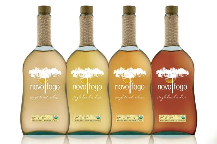 A lineup of the Novo Fogo cachaça bottles, arranged lightest to darkest from left to right