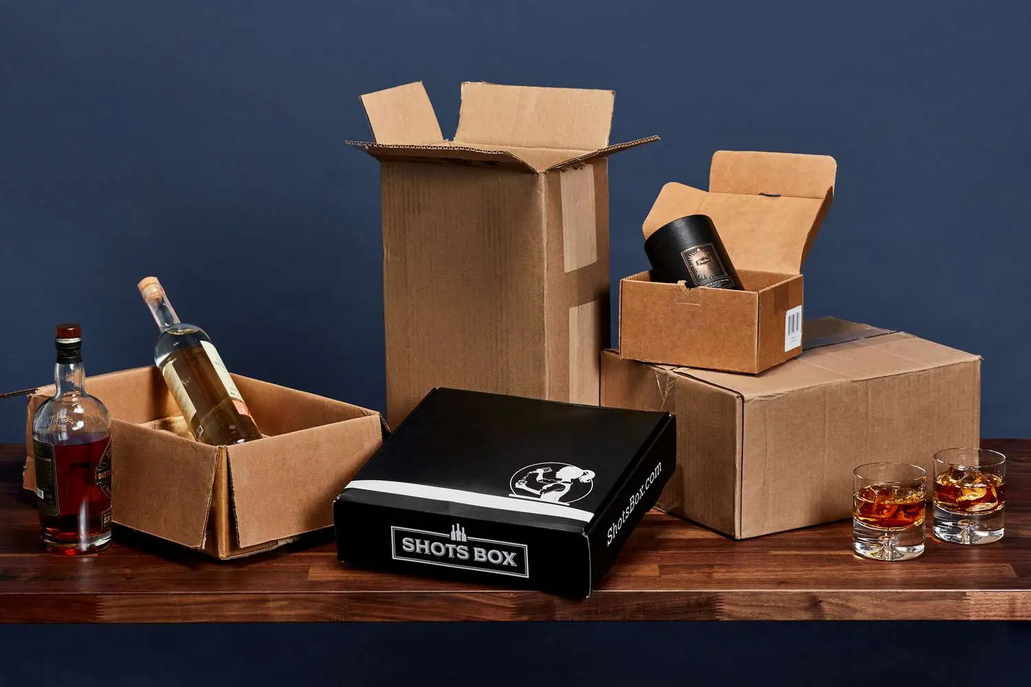 cardboard shipping boxes arranged on a wooden counter