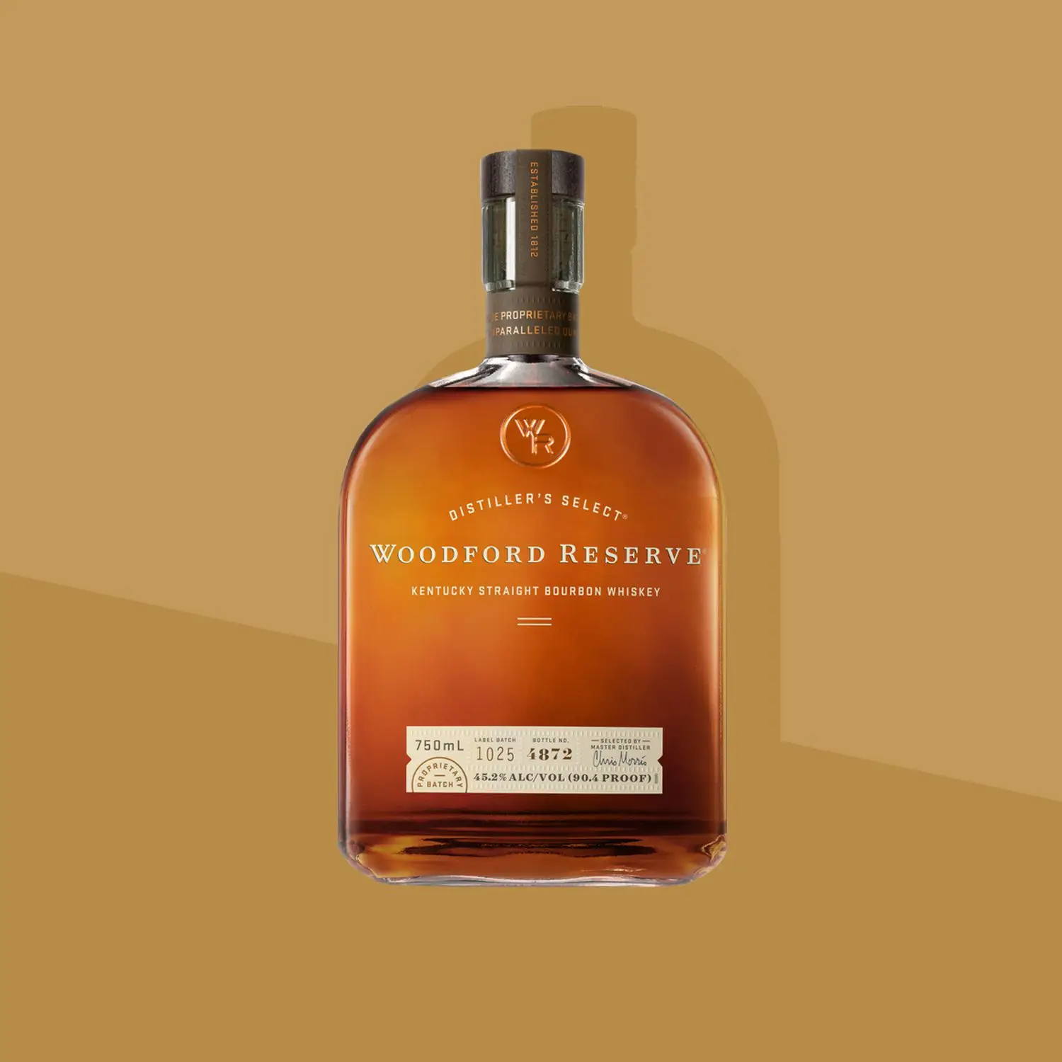 Bottle shot of Woodford Reserve Kentucky Straight Bourbon on two-toned tan background